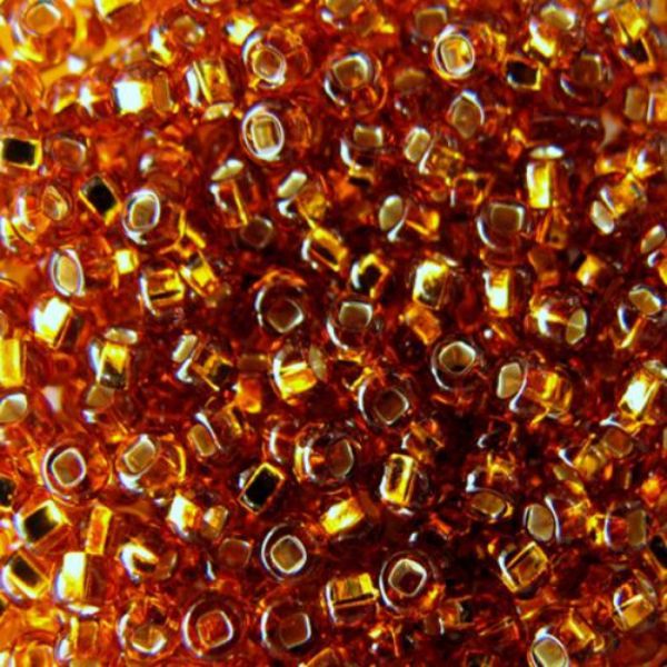 Бісер Чеський №17090  Круглий напівпрозорий коричневий зі срібною серединкою